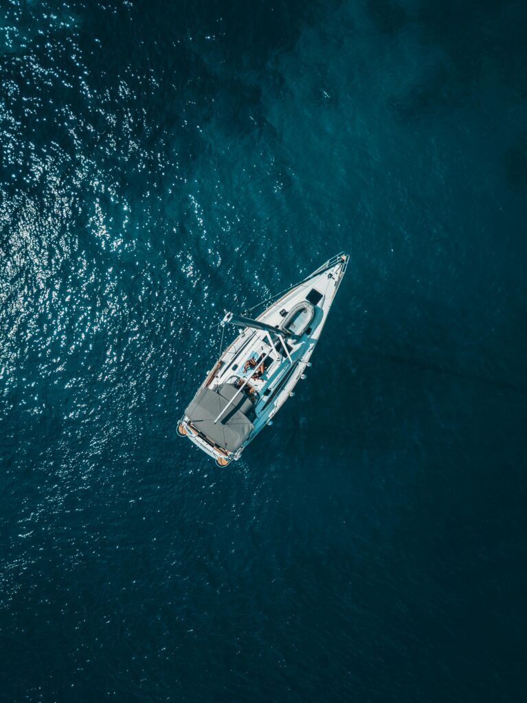 pexels-photo-1295036-1295036 A stunning aerial shot of a sailboat cruising the deep blue waters of Croatia.