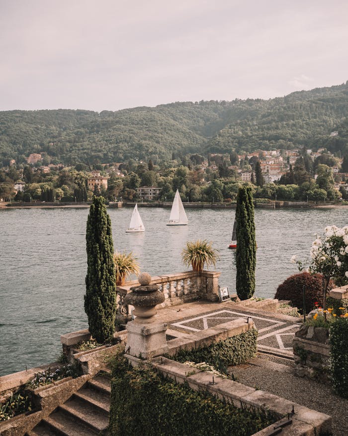 pexels-photo-18156174 Elegant view over Lake Maggiore with sailboats and Italian gardens in Stresa, Piedmont, Italy.