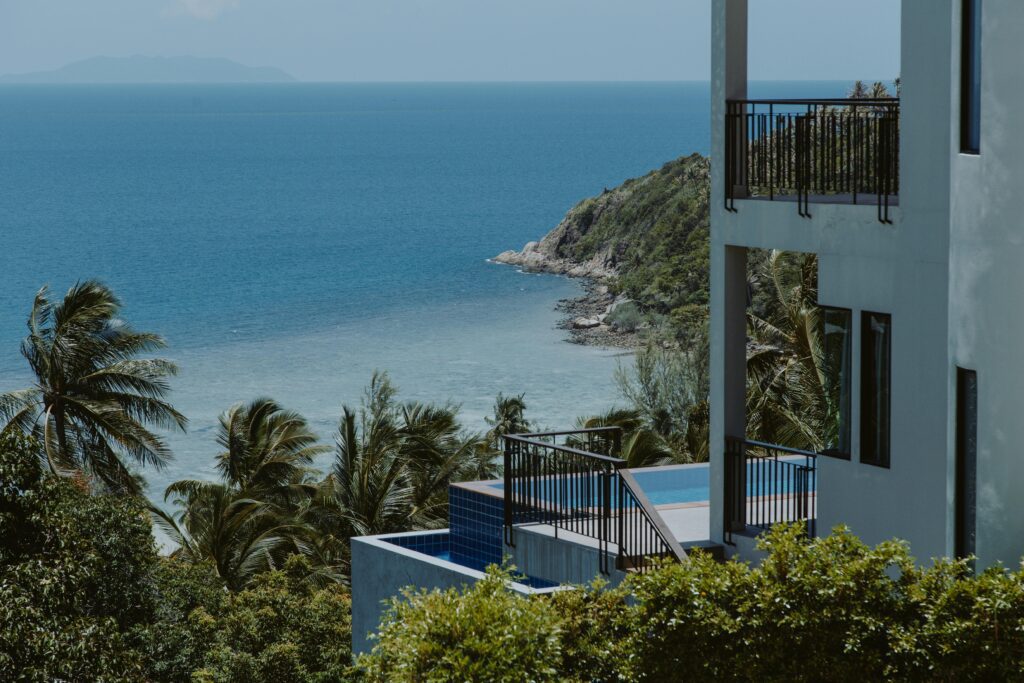 Stunning ocean view from a tropical resort balcony, perfect for a summer vacation.